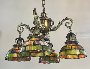 Incredible Early 1900s Beaux Arts Four Light Cast Bronze and Brass Dolphin Arm Chandelier with Original Leaded Glass Shades