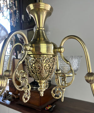 Antique Circa 1890 Late Victorian Converted Gas Four Light with Cast Neo Classical Center Body Scroll Arms and Signed Gillender Shades
