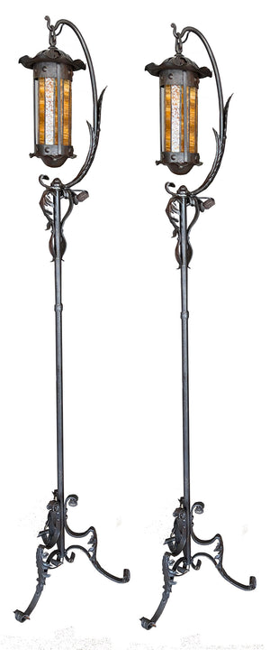 $3000 PAIR - Incredible pair of early 1900s Arts and Crafts Wrought Iron Lantern Floor Lamps with Amber Glass Cylinder Shades