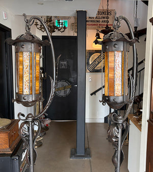 $3000 PAIR - Incredible pair of early 1900s Arts and Crafts Wrought Iron Lantern Floor Lamps with Amber Glass Cylinder Shades