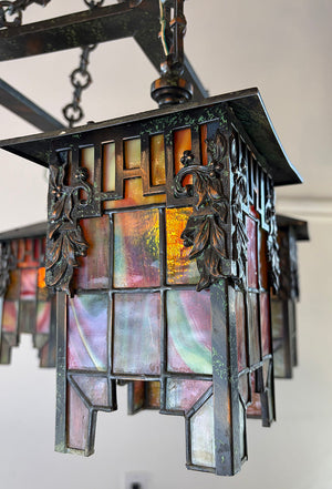 Antique Circa 1905-1910 Arts and Crafts Four Light Chain Suspended Chandelier with Leaded Glass Lantern Shades and Original Japanned Copper Verdegris Finish