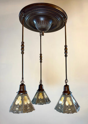 Antique Circa 1915 Edwardian Three Light Embossed Cascade Fixture with Signed Bradley and Hubbard and Filigree Slag Glass Shades