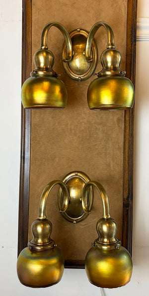 $1950 PAIR -Stunning Pair of Circa 1905-10 Cast Brass Double Light Sconces Attributed to Bradley and Hubbard with a Matching Set of Gold Aurene Steuben Shades