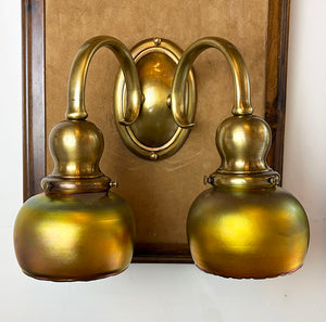 $1950 PAIR -Stunning Pair of Circa 1905-10 Cast Brass Double Light Sconces Attributed to Bradley and Hubbard with a Matching Set of Gold Aurene Steuben Shades