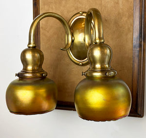 $1950 PAIR -Stunning Pair of Circa 1905-10 Cast Brass Double Light Sconces Attributed to Bradley and Hubbard with a Matching Set of Gold Aurene Steuben Shades