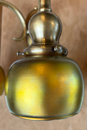 $1950 PAIR -Stunning Pair of Circa 1905-10 Cast Brass Double Light Sconces Attributed to Bradley and Hubbard with a Matching Set of Gold Aurene Steuben Shades