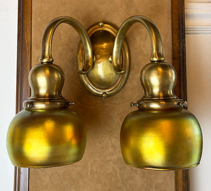 $1950 PAIR -Stunning Pair of Circa 1905-10 Cast Brass Double Light Sconces Attributed to Bradley and Hubbard with a Matching Set of Gold Aurene Steuben Shades
