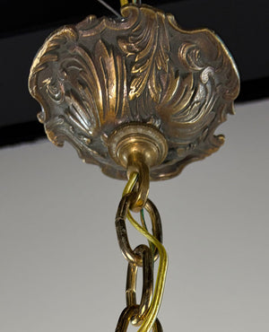 Antique Circa 1920 Ten Light European Bronze Rococo Revival Chandelier with Cast Figural Cherub