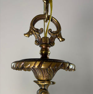 Antique Circa 1920 Ten Light European Bronze Rococo Revival Chandelier with Cast Figural Cherub