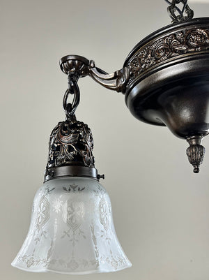 Antique Circa 1915 Embossed and Cast Arm Pan Light with Decorative Filigree Shade Holders and Original Stencil Etched Shades
