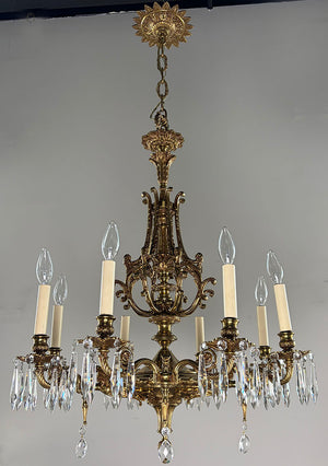 Antique Circa 1940 European Empire Eight Light Cast Brass Chandelier with Gryphon Head Arms