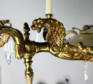 Antique Circa 1940 European Empire Eight Light Cast Brass Chandelier with Gryphon Head Arms