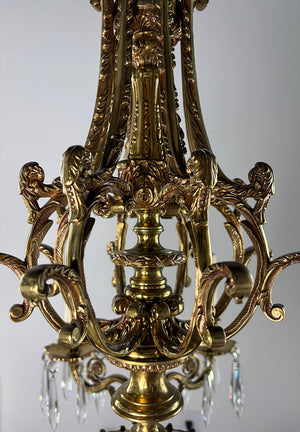 Antique Circa 1940 European Empire Eight Light Cast Brass Chandelier with Gryphon Head Arms