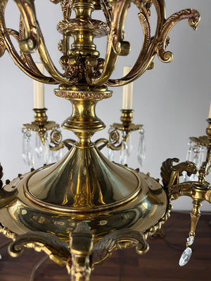 Antique Circa 1940 European Empire Eight Light Cast Brass Chandelier with Gryphon Head Arms