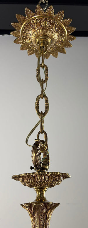 Antique Circa 1940 European Empire Eight Light Cast Brass Chandelier with Gryphon Head Arms