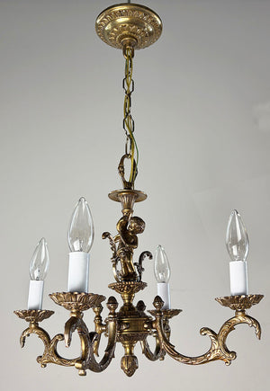 Antique Circa 1940 Cast Brass Petite Four Light Chandelier with a Cast Cherub