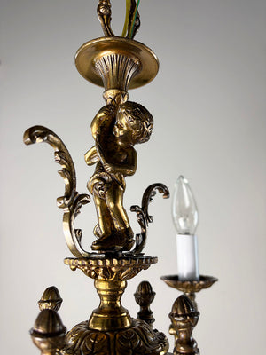 Antique Circa 1940 Cast Brass Petite Four Light Chandelier with a Cast Cherub