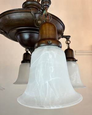 Antique Circa 1920 Four Light Cast Arm Pan Light with Stepped Center Body and Contemporary Glass Alabaster Style Shades  no