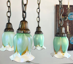 Antique Circa 1905 Deep Embossed Acanthus Patterned Four Light Cascade with Original Signed Quezal Pulled Feather Shades